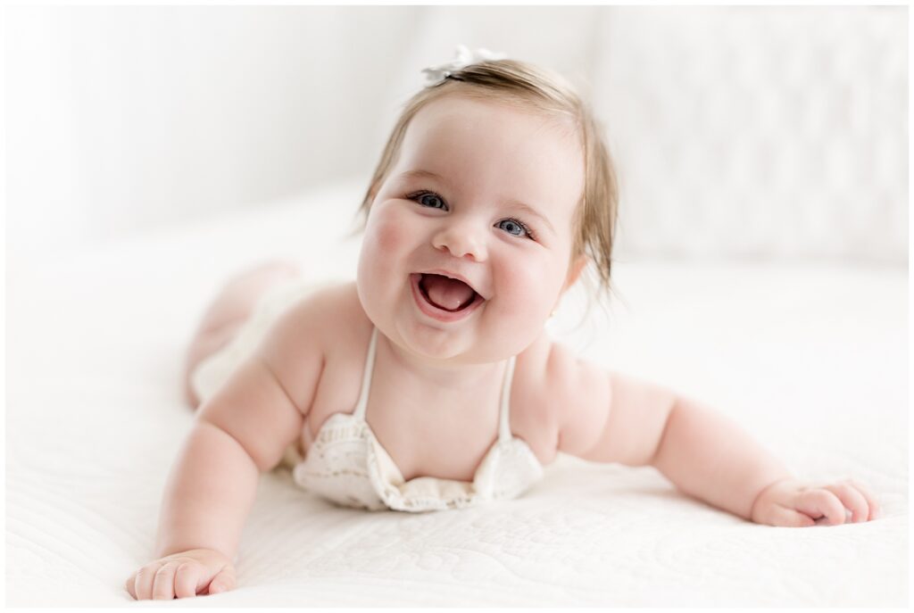 This joyful baby photo session featured 6 month old baby Luna, who was the sweetest, most smiley girl.